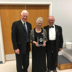President Harvey Granatier presents appreciation gift to Marty & Clare Schneider