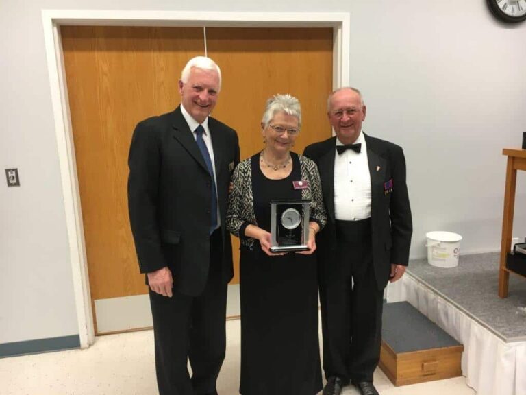 President Harvey Granatier presents appreciation gift to Marty & Clare Schneider