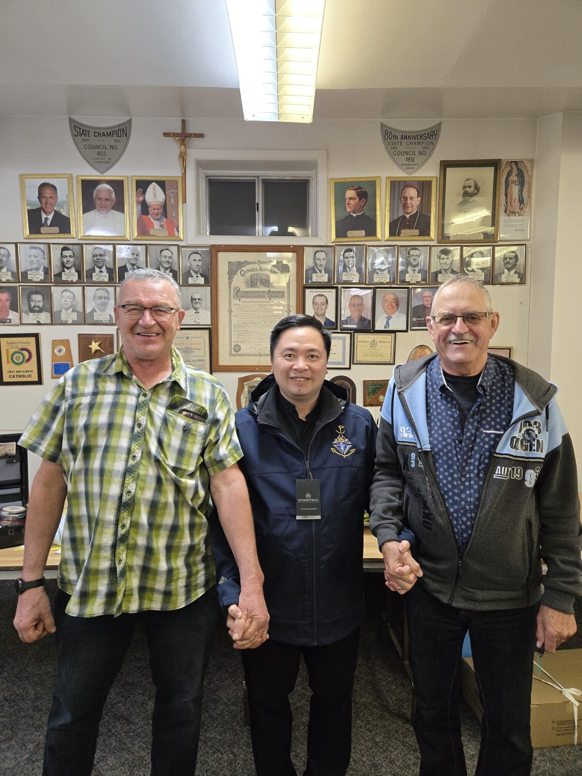Grand Knight Denis Quenelle, Chaplain Father Chinh Vu, and Brother Real Wolensky.