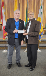 Charitable Foundation and Council #8896 Unite to Feed Those in Need 6 GK Eugene presents cheque to Fr. Oliver - Holy Child Parish - Families in Need