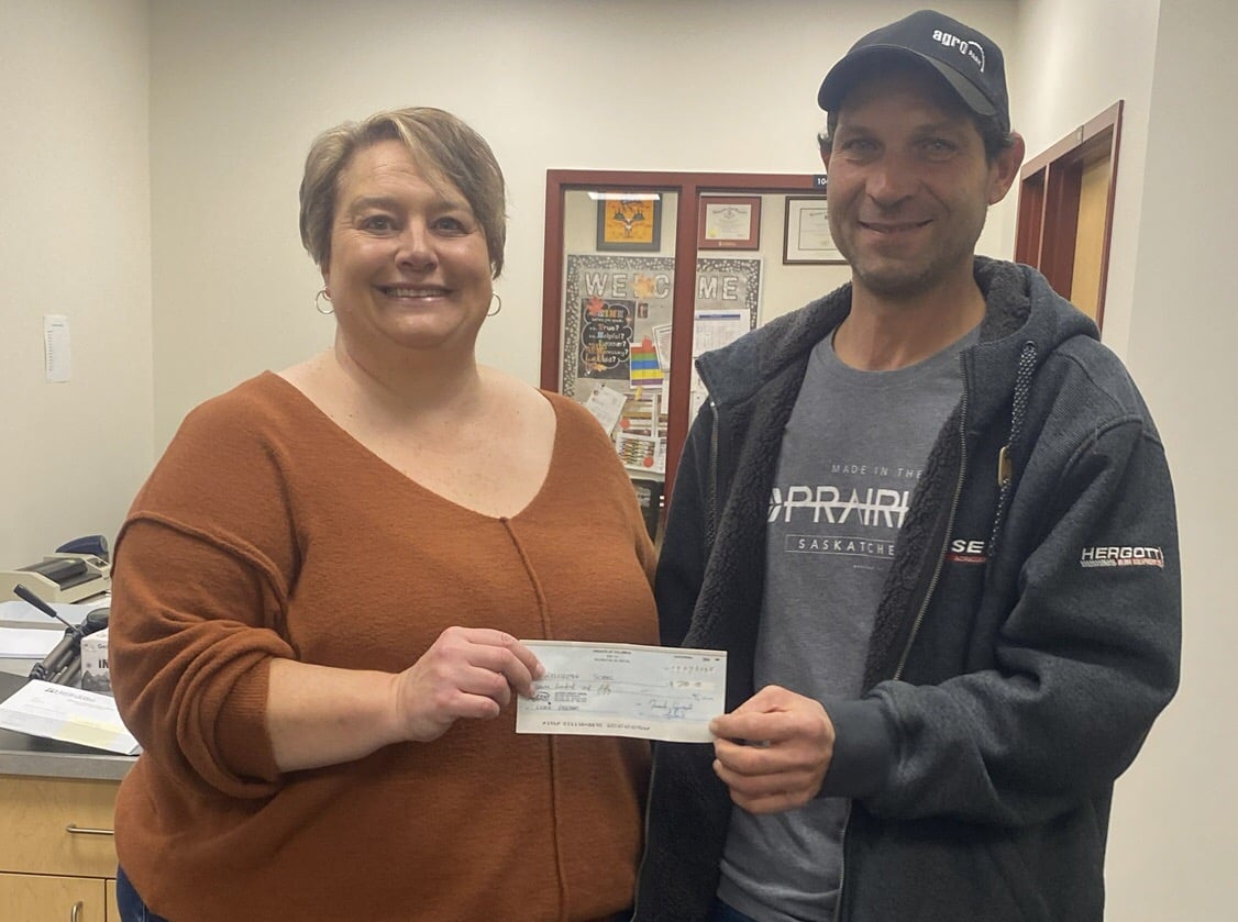 Br. Mike Federko, DKG, presents the cheque to the Principal of Kelvinton School