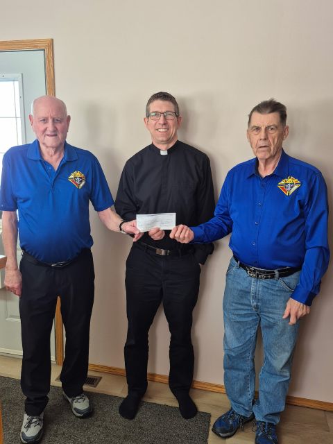 Unity Council #5707 in Unity Presents Their Incentive Cheques 7 Peter Gartner, Finance and Building Committee, Father Matthew Ramsay, St Peter's Parish and Richard Colbow.