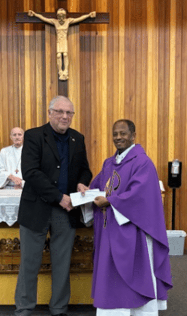 Archbishop O’Neill Council #8896 in Regina Presents Their Incentive Cheques 2 GK Eugene presents chq to Fr. Abadu (Saturday