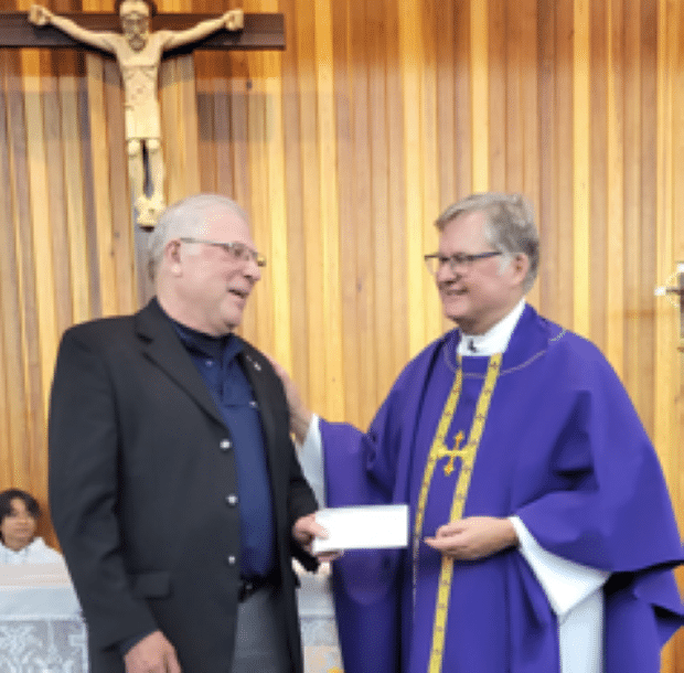 Archbishop O’Neill Council #8896 in Regina Presents Their Incentive Cheques 1 GK Eugene presents chq to Fr. Fahlman (Sunday Masses)