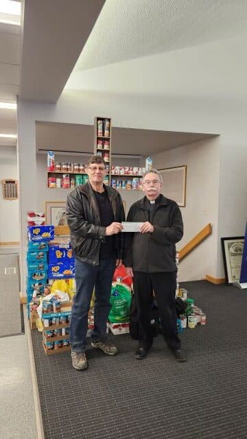 St. Philip Neri Council #9539 in Saskatoon Presents Their Incentive Cheques 1 Presenting a cheque to St. Philip Neri Parish. Merv Wiesner GK presenting to Fr. Ed Gibney