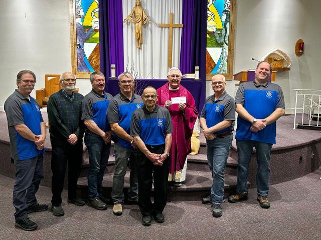 St. Michael Council #9949 in Prince Albert Presents Their Incentive Cheque 4 Names L to R: Claude St. Germaine, John Kreiser, Luc Robin, Dave Schultz, Phil Ruel, Msgr. Maurice Fiolleau, Darryl Sande, Don Bissky