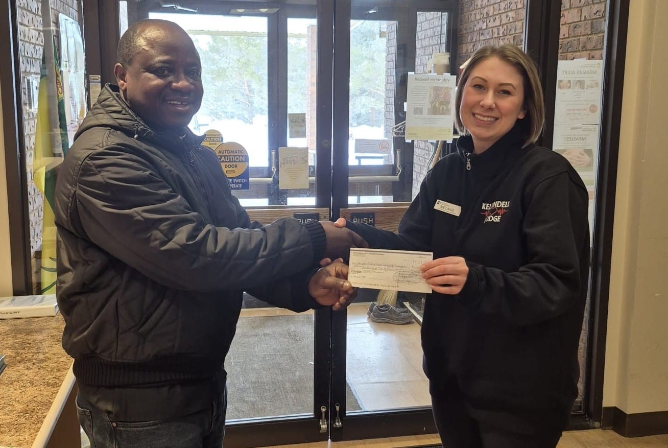 Kelvington Health Care Facility , cheque presented by Fr, Jerome, Chaplin of council to Melanie Turnbull