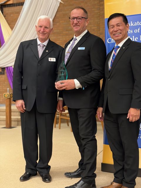 Awards Presented 4 Davidson/Outlook Council 5384 - PSD Larry Packet accepts the award for Grand Knight David Alm, Sask K of C Charitable Foundation President Harvey Grantier, and Supreme Representative Toni Pascua