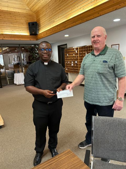 Sask K of C Charitable Foundation donates to Lanigan Food Bank and St. Mary's Parish 2 Grand Knight Paul Mamer of Fr. Sinnett Council 6068 in Lanigan, delivers a donation. Receiving it is Fr. Augustine from the Sask K of C Charitable Foundation to ST. Mary's Parrish, Lanigan, May 3rd