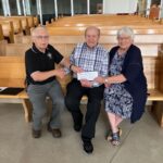 Grand Knight Gord Hagan from Swift Current Council 3031 with James & Alma Meier